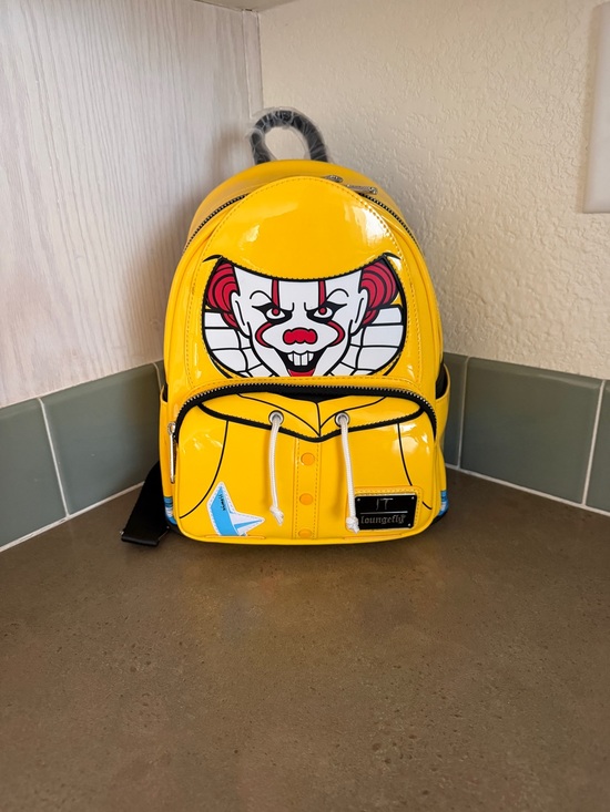Loungefly Handbags - Loungefly Yellow Pennywise Backpack